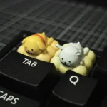 Close-up of an adorable handcrafted resin dog keycap, showcasing the minimalist line art pet enjoying a tranquil spa moment.