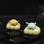 Adorable handcrafted resin dog keycap featuring minimalist line art pets enjoying a playful spa moment. A unique custom keyboard accessory.