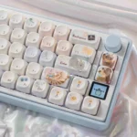 Meow-Woof Paradise PBT dye-sub keycap set with whimsical illustrations in vibrant pastels, shown from multiple angles.