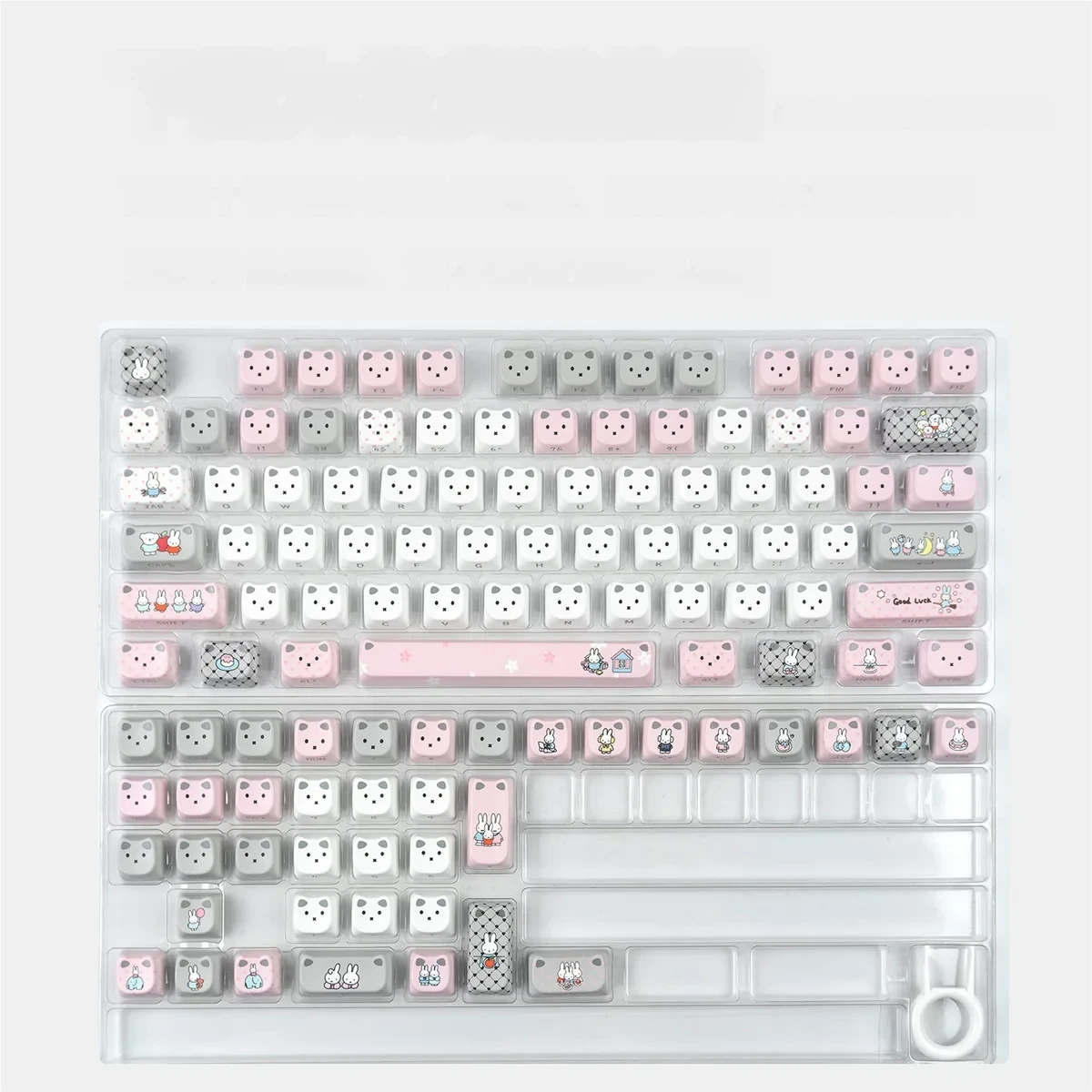 Playful Miffy cat ear RGB keycap set, viewed from a delightful angle, showcasing its glowing ears and vibrant RGB lighting.