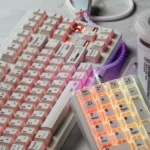 Minimalist white side-printed PBT keycaps, highlighting unique light refraction and hidden legends from various views for backlit.
