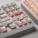 Minimalist white PBT keycaps with side-printed legends and unique light refraction. This gallery highlights their clean, backlit design from multiple angles.