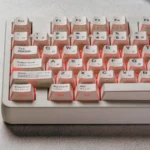 Explore various angles of the minimalist white PBT keycaps, highlighting the elegant side-printed legends, subtle hidden legends, and unique light.