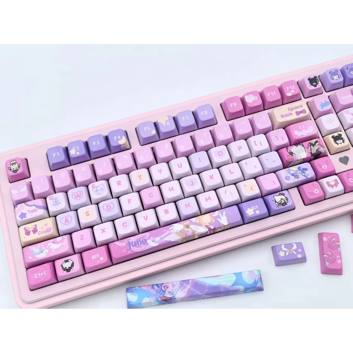 Overwatch Juno's Spirit MDA PBT gaming keycaps set, shown from various angles, highlights its vibrant character art and futuristic design.