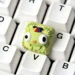 Whimsical PEAK Bing Bong artisan keycap, showcasing its vibrant, hand-painted details and sculpted character from various angles for unique keyboard.