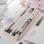 Pink bandage puppy keycap for keyboards, seen from a new angle, accentuating its whimsical design and smooth MOA profile.