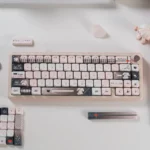 Multiple angles of charming pink bandage puppy keycaps, highlighting their adorable pastel design and whimsical MOA profile for a playful keyboard.