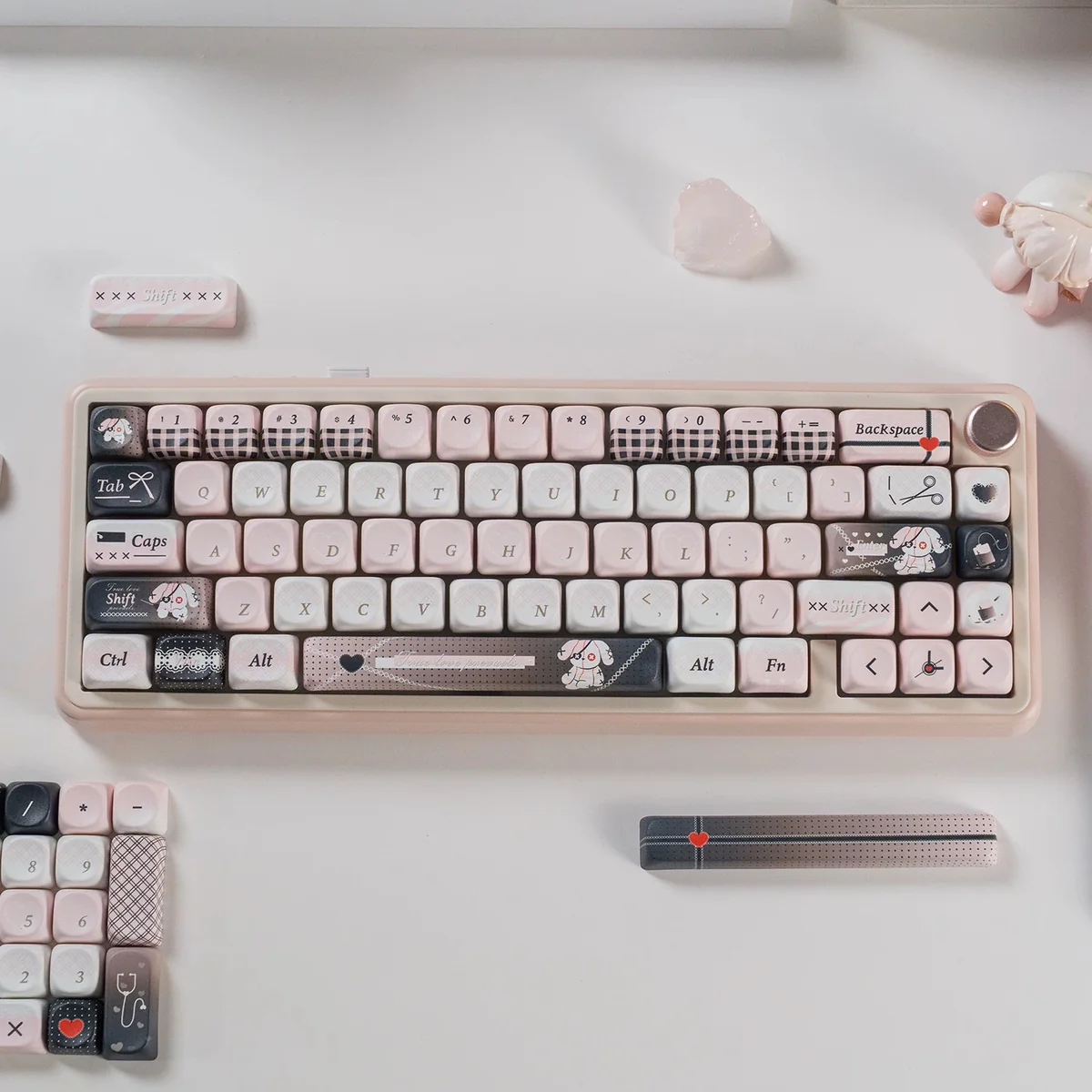 Multiple angles of charming pink bandage puppy keycaps, highlighting their adorable pastel design and whimsical MOA profile for a playful keyboard.