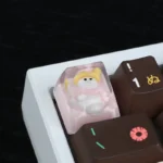 Close-up of a whimsical handcrafted resin snowman artisan keycap, showcasing its intricate details and adorable design from a different angle.