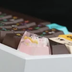 Whimsical handcrafted resin snowman artisan keycap, expertly sculpted from a delightful side angle, revealing its charming details.