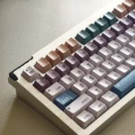Detailed shot of the Pixel Tibetan Secret Keycap Set, highlighting the unique retro pixel art and mystical ancient Tibetan script legends, embodying digitall design.