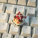 Whimsical San's Spirit Princess Mononoke handcrafted resin keycap, detailed from various angles, highlighting its vibrant artisan craftsmanship.