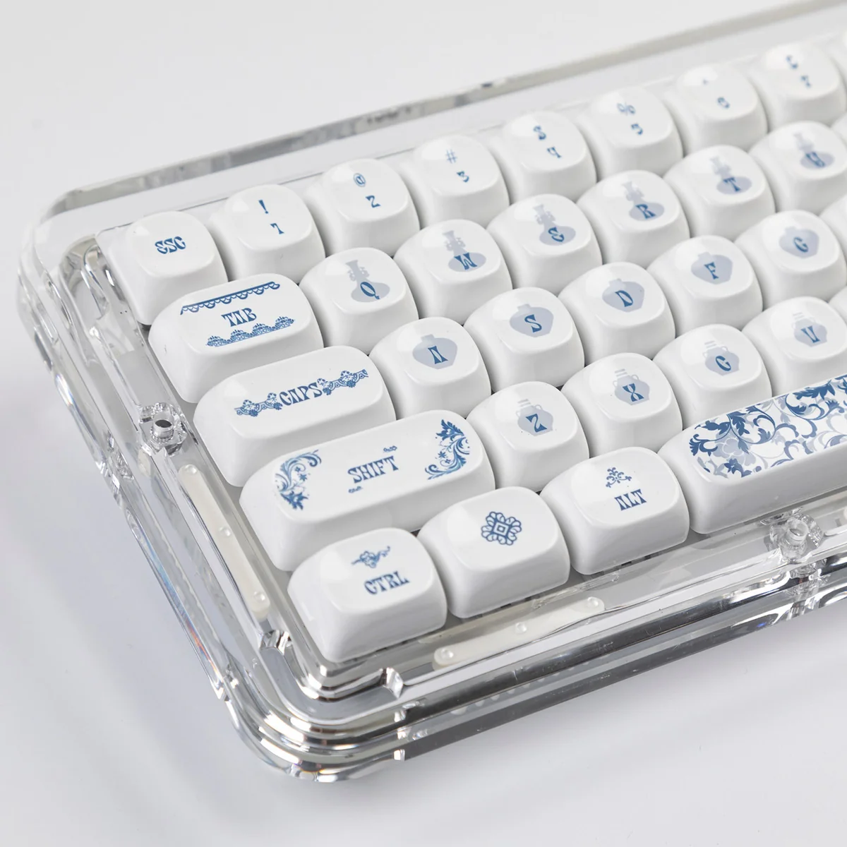 Exquisite Qinghua Porcelain PBT keycaps set. Multiple angles highlight elegant blue and white patterns, reflecting timeless classical Chinese aesthetic.
