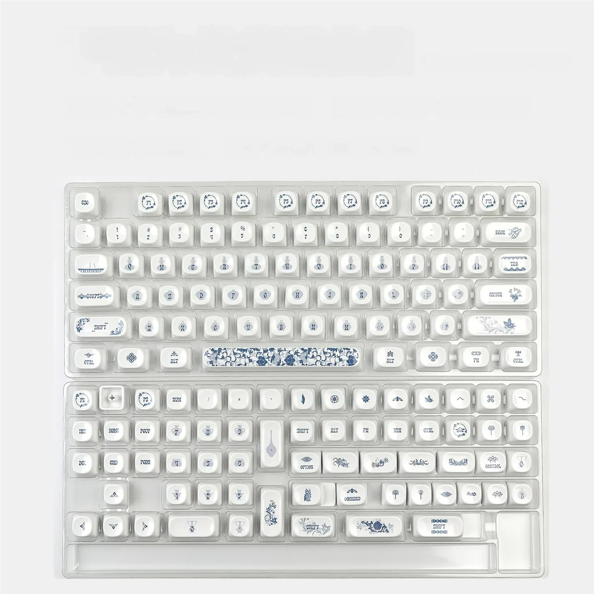 Qinghua Porcelain PBT keycaps set, elegant blue and white patterns from various angles. Classical Chinese artistry for tranquil mechanical keyboards.