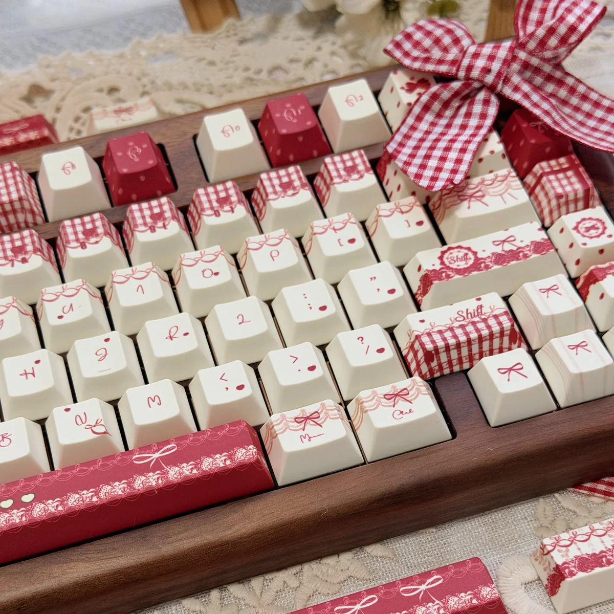 Close-up of the unique Raspberry Mousse PBT Dye-Sub Keycaps Set, showcasing their sweet berry-toned palette and playful dessert-inspired design from multiple angles.