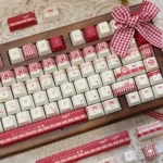 A close-up view of the unique Raspberry Mousse PBT Dye-Sub Keycap Set, showcasing its soft berry tones and playful, dessert-inspired design.