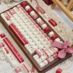 A delightful close-up of the Unique Raspberry Mousse PBT Dye-Sub Keycap Set, showcasing its soft berry and sweet dessert aesthetic.