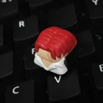 Premium handcrafted ONE PIECE Red-Haired Shanks artisan keycap, captured in a detailed close-up, highlighting the iconic character's intricate resin.