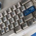 An artistic display of the distinctive Retro Geometric PBT Dye-Sub Keycap Set, showcasing classic patterns, vintage aesthetics, and a durable matte finish.