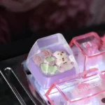 Close-up views of the whimsical handcrafted resin Rose Bear Artisan Keycap, emphasizing its unique translucent pastel design and ESC profile.