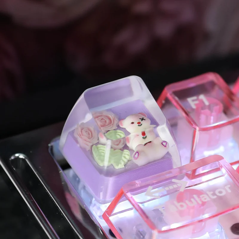 Close-up views of the whimsical handcrafted resin Rose Bear Artisan Keycap, emphasizing its unique translucent pastel design and ESC profile.