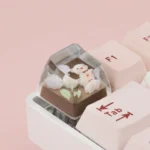 Close-up of a whimsical handcrafted resin rose bear artisan keycap, highlighting its unique translucent pastel charm and intricate details.