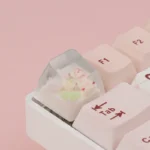 Whimsical handcrafted rose bear artisan keycap, featuring a sleeping bear motif in translucent resin for a playful ESC key.