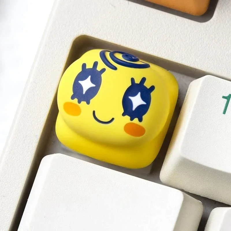 Charming pixel art Mametchi Tamagotchi keycap, meticulously handcrafted, brings playful nostalgia and a vibrant touch to any mechanical keyboard.