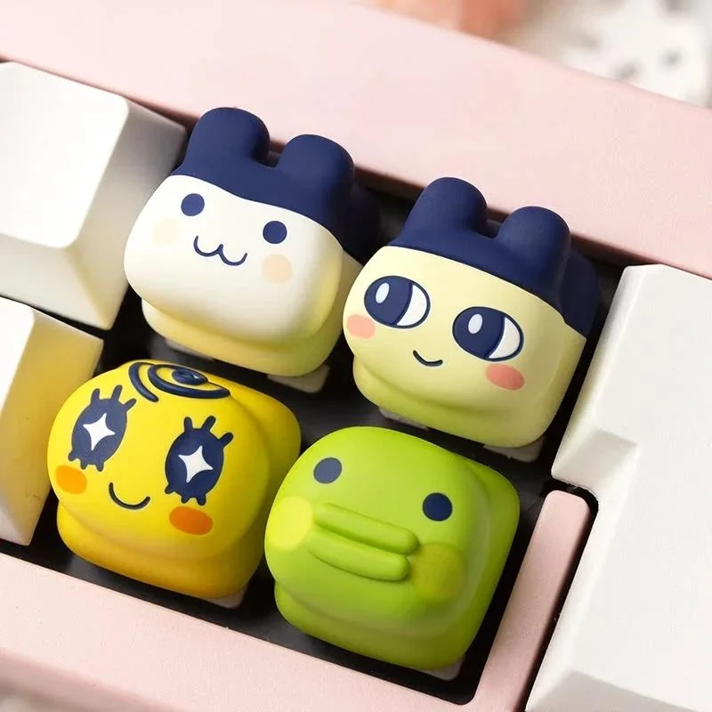 Charming Tamagotchi artisan keycap, a vibrant pixel pet keyboard charm, handcrafted for mechanical keyboards.
