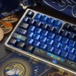 The Emperor Tarot Metallic PBT Keycaps Set. Unique dark metallic finish, intricate regal Tarot iconography. Distinct angle highlights premium PBT quality.
