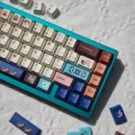 Authentic Tibetan Root Letter PBT dye-sub keycaps showcased from multiple angles, revealing vibrant Jataka motifs and serene calligraphy details.