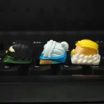 Iconic Valorant Agent artisan resin keycap displayed from a dynamic angle, highlighting its intricate 3D sculpting and vibrant, glossy details for gamers.