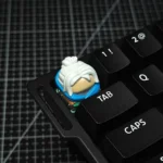 Premium Valorant Agent artisan resin keycaps, showcasing intricate 3D sculpted details of iconic agents from various angles with a vibrant, glossy finish.