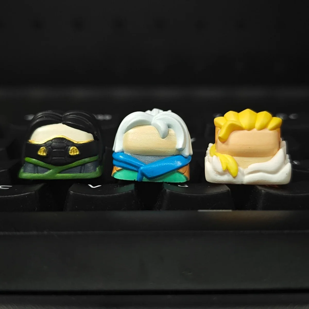 Premium Valorant Agent artisan resin keycaps, showcasing detailed 3D sculpted iconic agents in vibrant, glossy finishes for gamers.