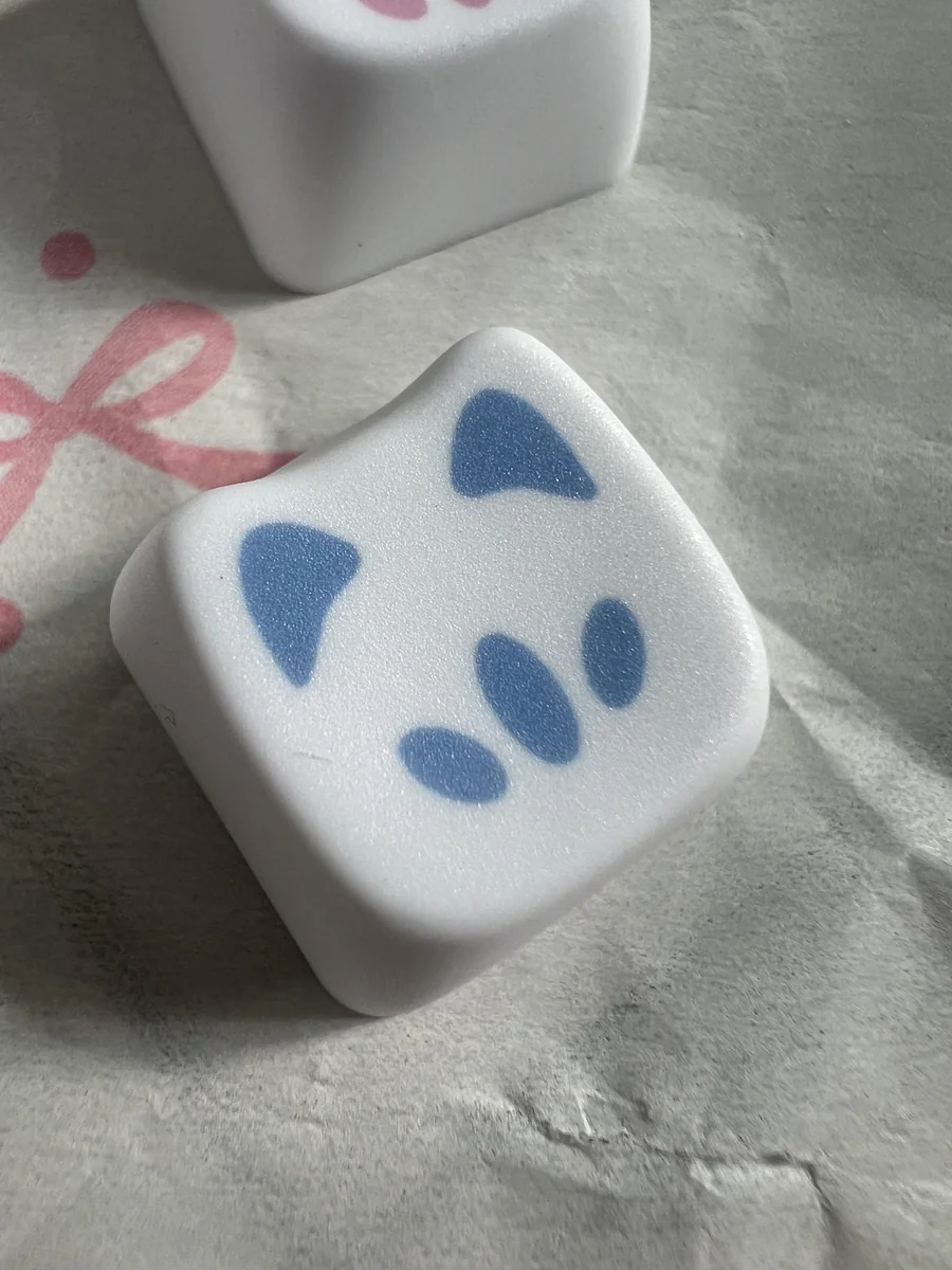 Four playful Omen Kitty PBT keycaps, featuring a stylized Valorant Omen aesthetic for a unique keyboard accent.
