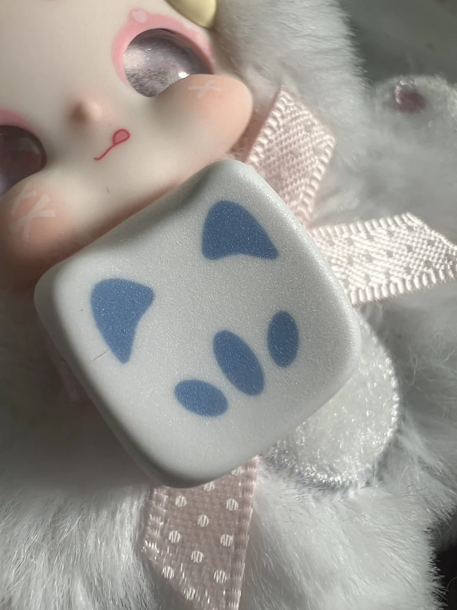 Four blue Valorant Omen Kitty PBT keycaps, featuring a playful stylized design inspired by the sleek Omen weapon for a custom gaming keyboard.