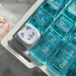 Close-up of a playful Valorant Omen Kitty PBT keycap, highlighting its sleek design for gamers.