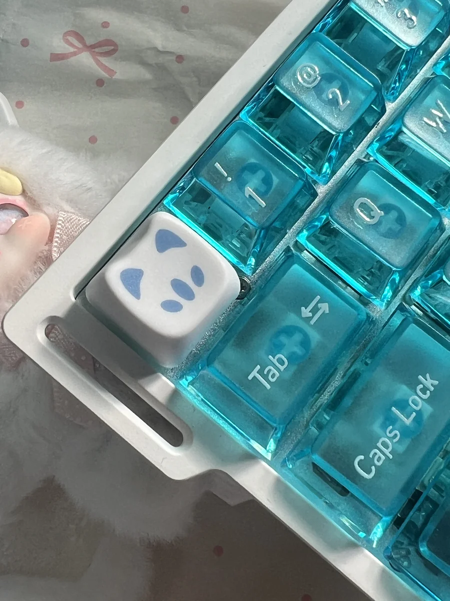 Close-up of a playful Valorant Omen Kitty PBT keycap, highlighting its sleek design for gamers.