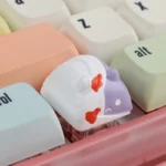 Detailed side view of the whimsical handcrafted zombie cat keycap, highlighting the intricate resin work and playful spooky charm for mechanical keyboard.