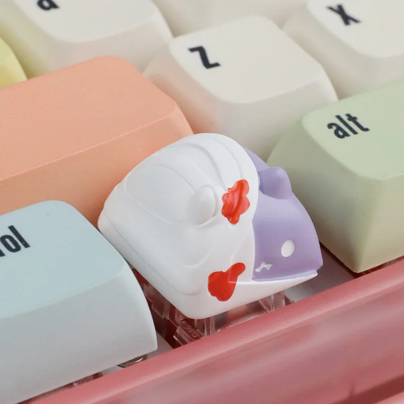 Detailed side view of the whimsical handcrafted zombie cat keycap, highlighting the intricate resin work and playful spooky charm for mechanical keyboard.