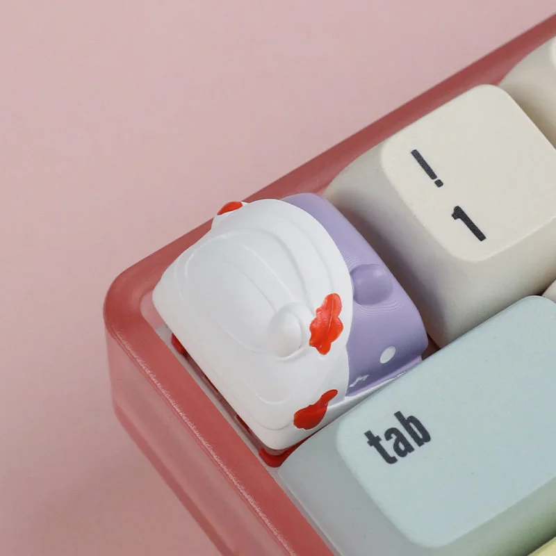 Detailed views of the quirky handcrafted resin zombie cat keycap for mechanical keyboards, showcasing its whimsical spooky-cute charm.