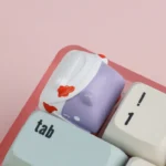 A side profile of the whimsical handcrafted Zombie Cat Keycap, revealing its unique resin texture and the playful yet spooky design for mechanical keyboard.