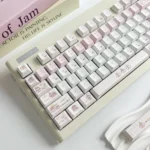 Close-up of the adorable Koala Party PBT keycap, showcasing its whimsical design and soft pastel colors. This playful keyboard charm adds a personalized to your keyboard.