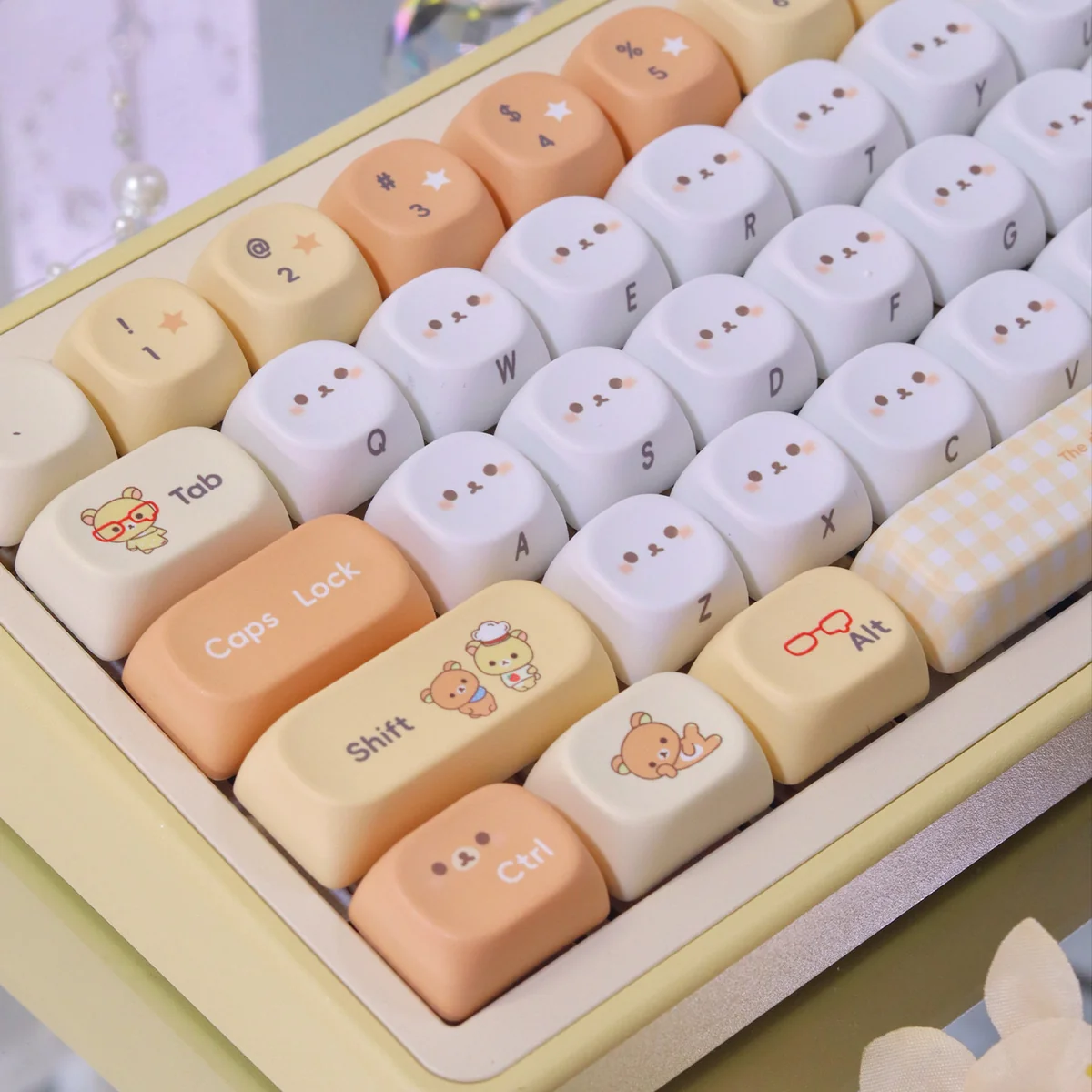 A playful gallery showcasing the adorable Rilakkuma & Kaoru PBT Dye-Sub MOA keycap from various angles, highlighting its cute pastel cartoon design.