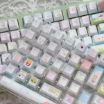Delightful close-up of Animal Playground PBT translucent keycap set, revealing whimsical animals frolicking on the durable, vibrant, dreamy surface.
