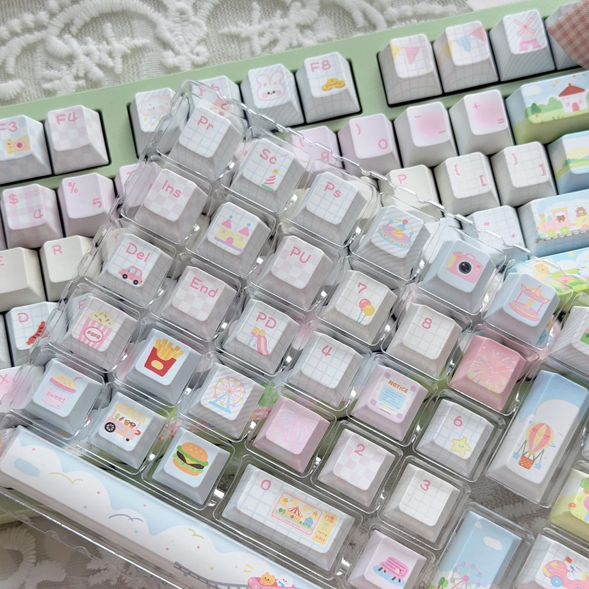 Delightful close-up of Animal Playground PBT translucent keycap set, revealing whimsical animals frolicking on the durable, vibrant, dreamy surface.