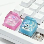 Multiple angles of a dreamy artisan cloud keycap, showcasing its handcrafted 3D translucent resin and cheerful smiling expression.