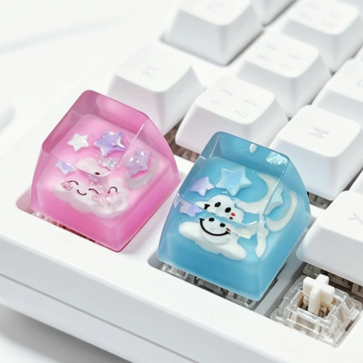 Multiple angles of a dreamy artisan cloud keycap, showcasing its handcrafted 3D translucent resin and cheerful smiling expression.