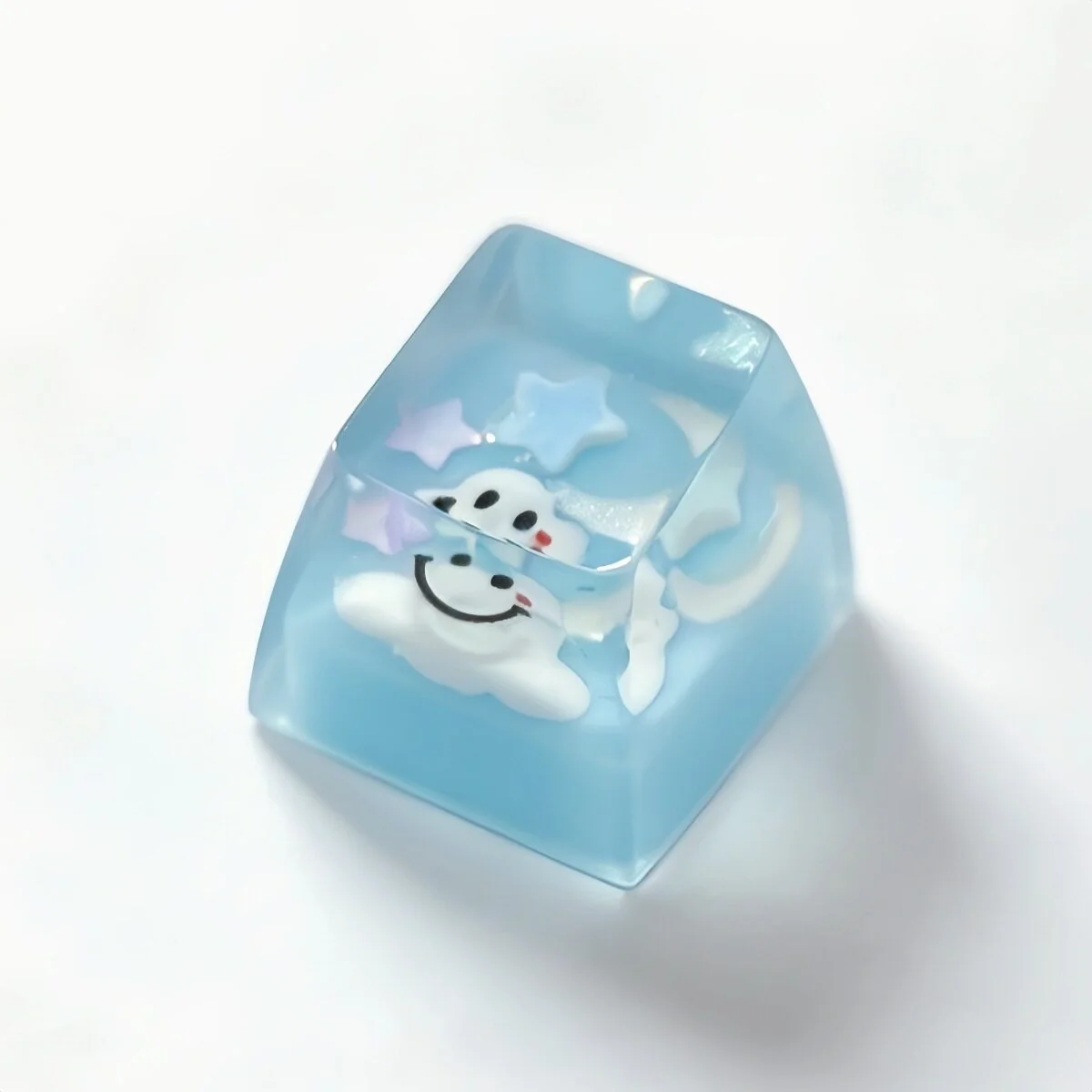 Handcrafted artisan cloud keycap in translucent resin, captured from multiple artistic angles, revealing its dreamy pastel 3D smiling expression.
