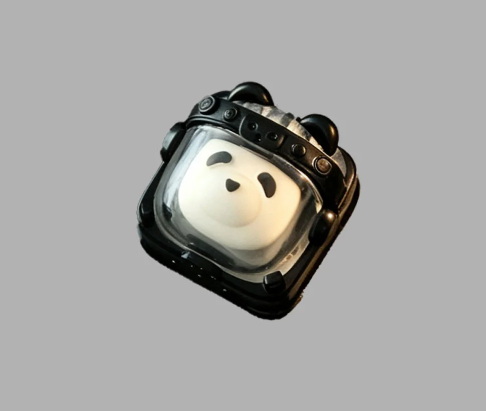 Whimsical handcrafted Astronaut Panda Resin Keycap, meticulously detailed, glowing with cosmic charm for mechanical keyboards.
